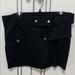Short black skirt silver button detail